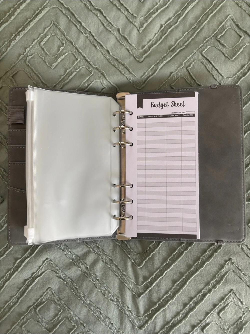 Grey budget binder with zipper pockets and budget tracker sheets